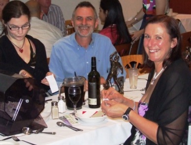 The work behind the scenes is never done - even on Presentation Night! April Taylor (left) helps Phill King and Victoria Thorneycroft with the raffle tickets.